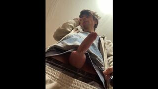 a dude in a winter hat with earflaps and a blue jacket, wanks his man sausage and spunks with scorching man gravy