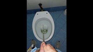 a youthfull man went into a filthy public rest room to piss and jack off